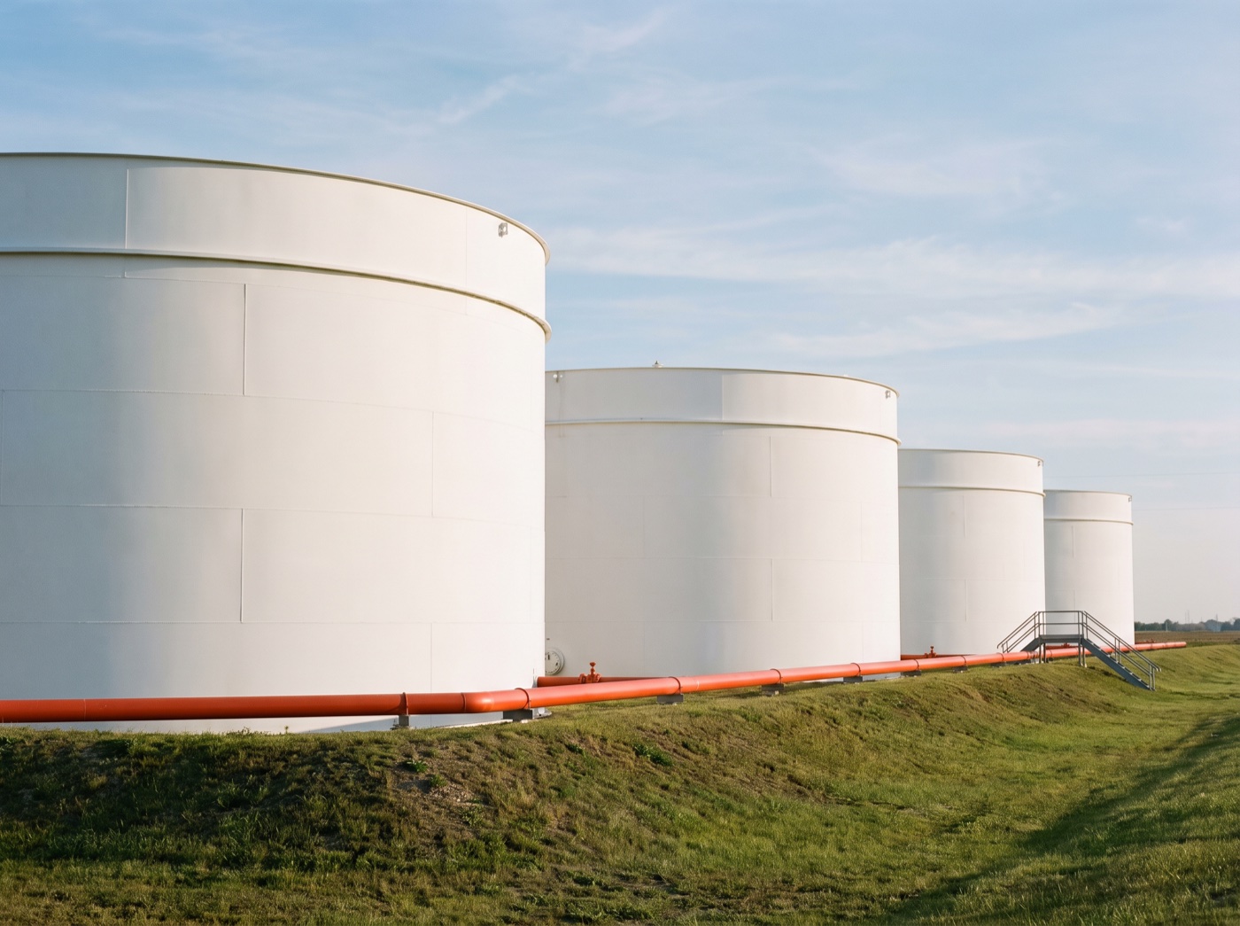 Large field-erected welded aboveground storage tanks in a tank farm
